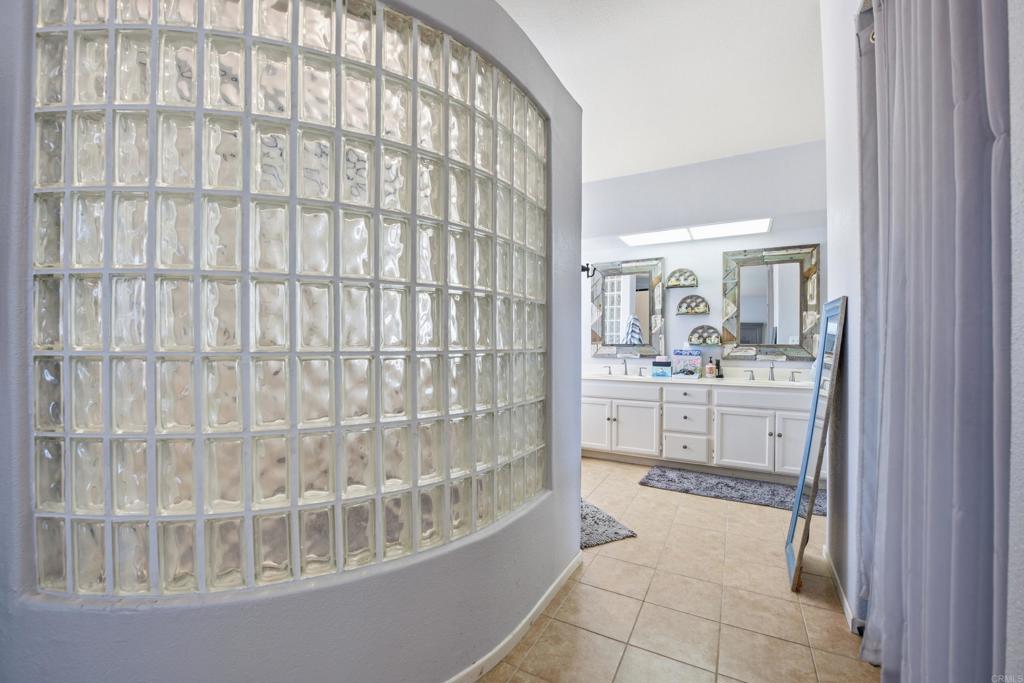 2077 Westwood Road Vista, CA 92083 - Photo 23 of 37 a bathroom with a sink and a mirror