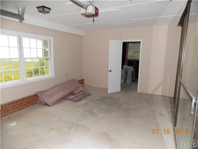 5657 Benson Hardee Road Benson, NC 27504 - Photo 11 of 16 a view of an empty room with a window
