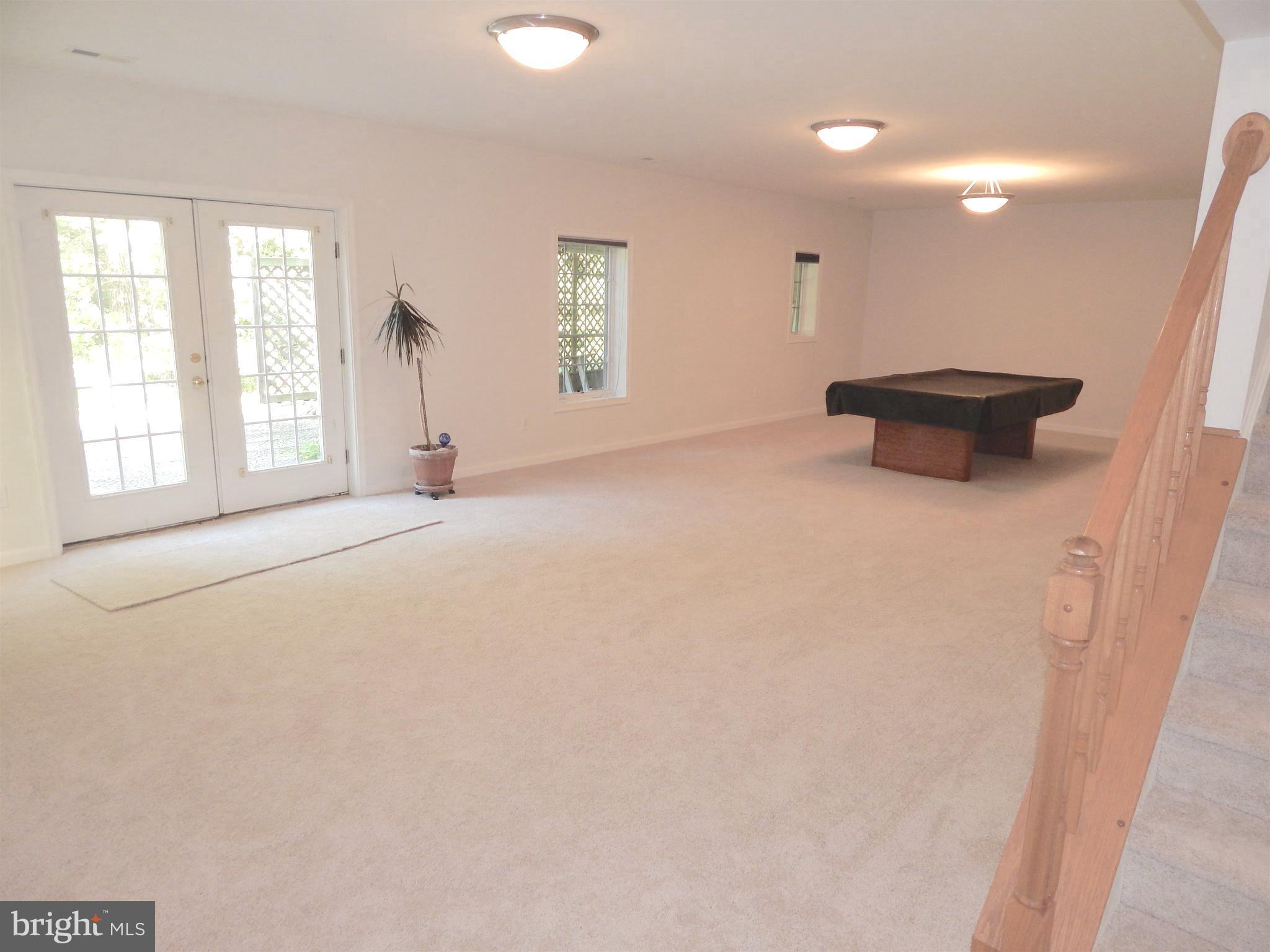 65 Sycamore Ridge Road Fredericksburg, VA 22405 - Photo 20 of 30 Rec Rm aprx 35x17- new Carpet 3/17- Doors to Patio