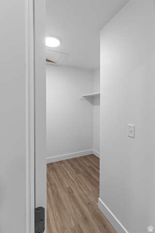 2995 South 265th Street West, Unit 752 Logan, UT 84321 - Photo 10 of 21 Compact storage area featuring wood-finish flooring, crisp white walls, and a recessed ceiling light