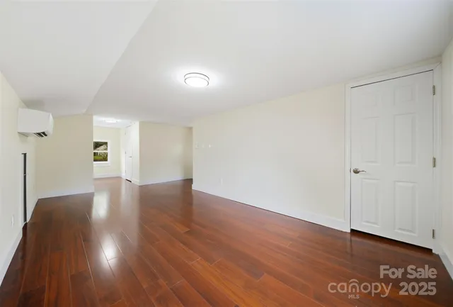 a view of a livingroom with wooden floor