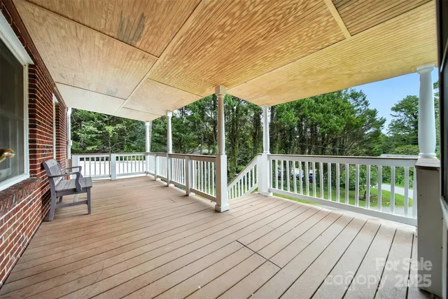 a view of balcony with wooden floor