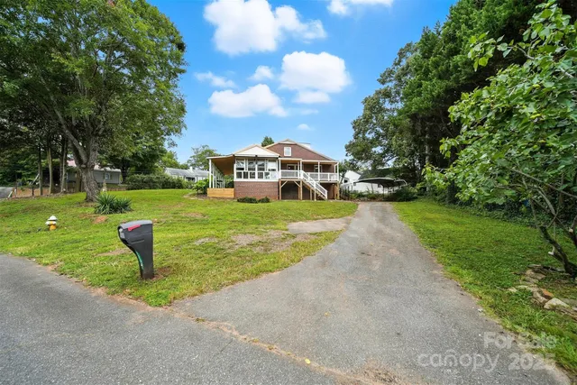 a view of a park with large trees