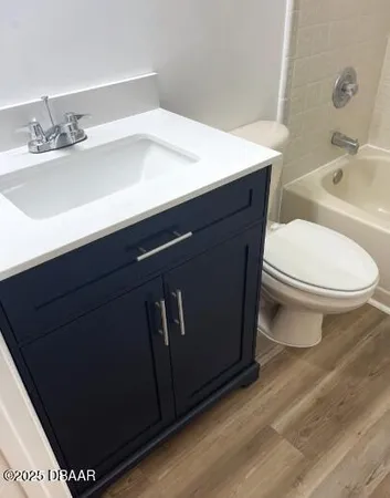 a bathroom with a sink toilet and vanity