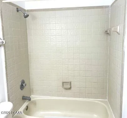 a bathroom with a shower and a bathtub