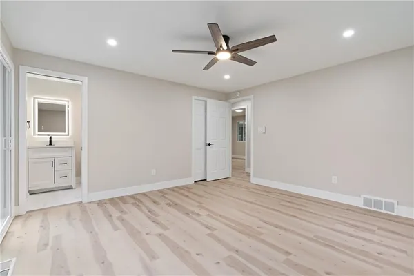 a view of an empty room and wooden floor