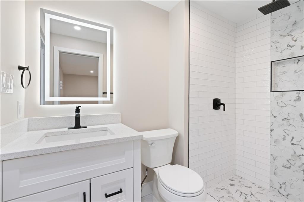 4309 Bulltown Road Murrysville, PA 15668 - Photo 18 of 34 a bathroom with a sink toilet and mirror