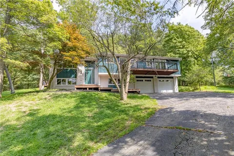 a view of a house with a back yard