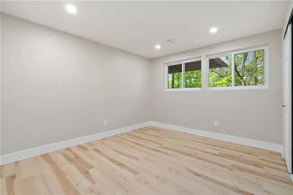 a view of room with window and hardwood floor