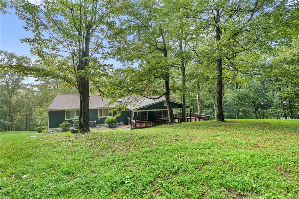 4309 Bulltown Road Murrysville, PA 15668 - Photo 28 of 34 a view of a house with a big yard and large trees