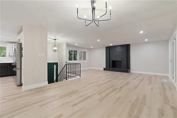 a view of a livingroom with a furniture wooden floor and window