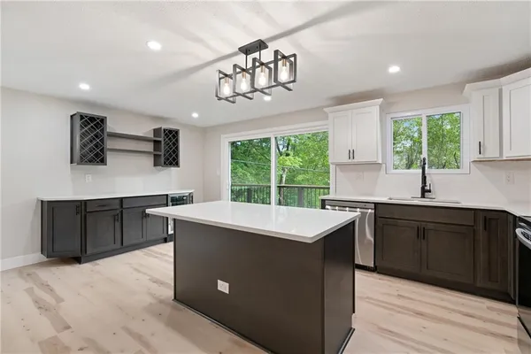 a kitchen with a sink stove and cabinets