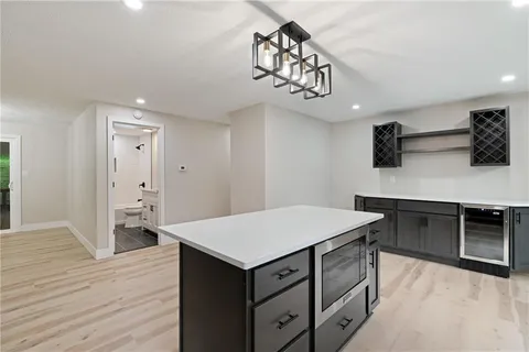 a kitchen that has a lot of cabinets in it