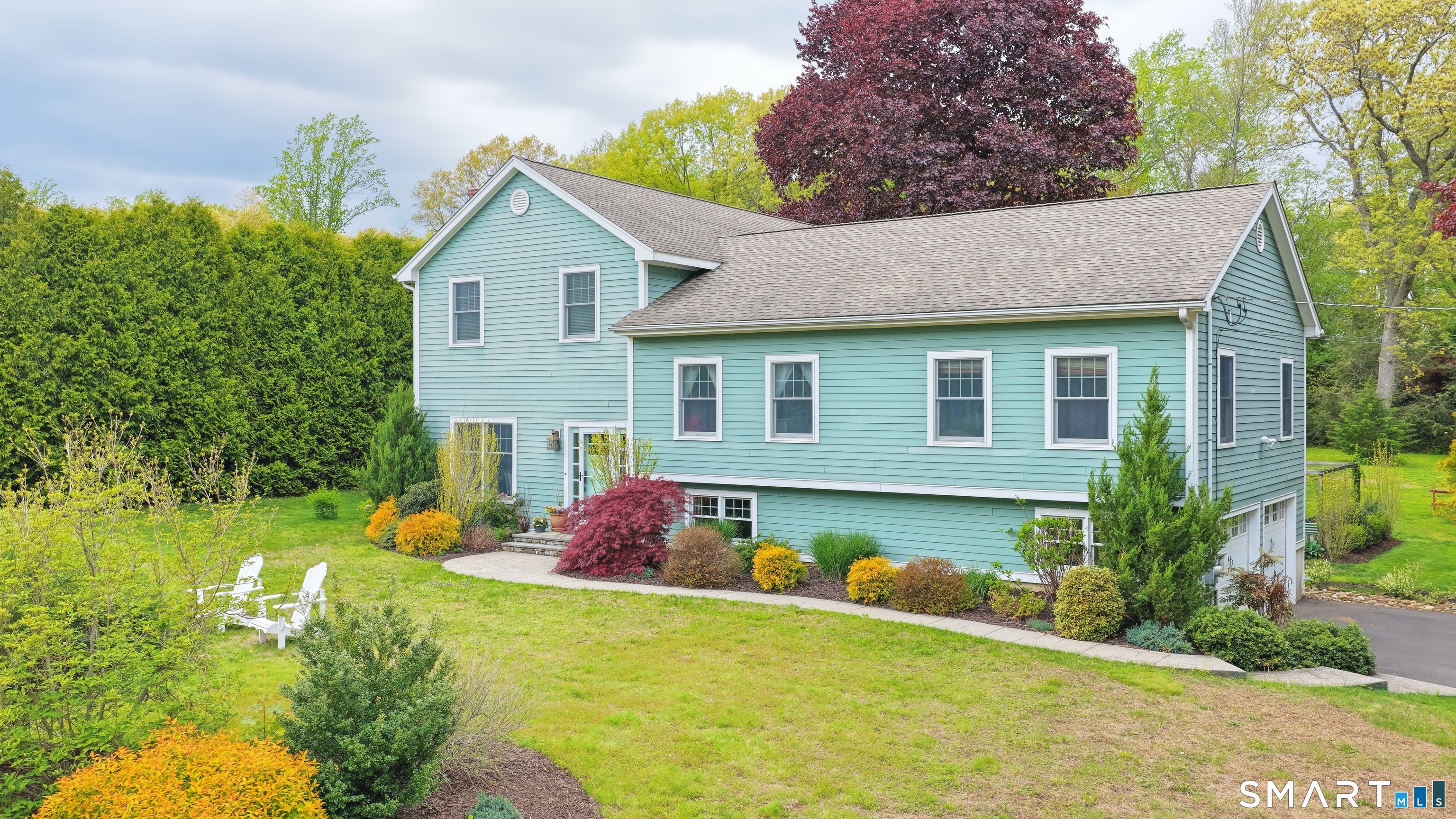 22 Round Ridge Trail Trumbull, CT 06611 - Photo 1 of 1 a front view of house with yard and trees in the background