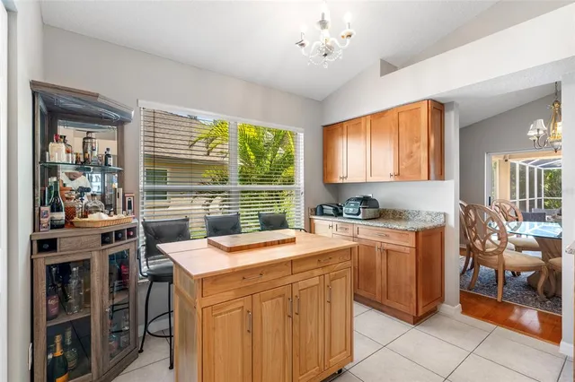a kitchen filled with stainless steel appliances granite countertop a sink and cabinets