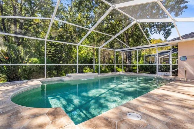 a view of a house with backyard sitting area and garden