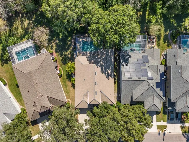 an aerial view of residential houses with outdoor space