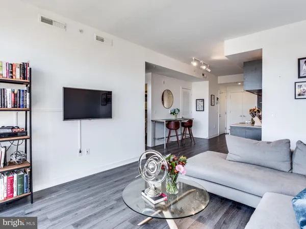 a living room with furniture and flat screen tv