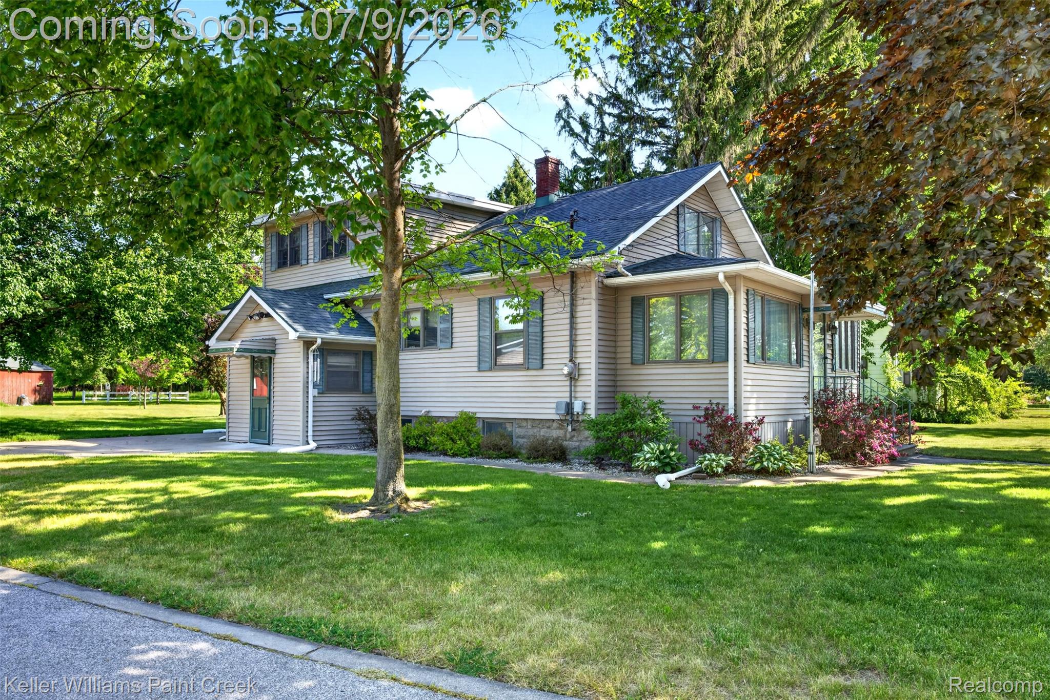 204 Russell Road Kawkawlin, MI 48631 - Photo 1 of 82 Two-story property featuring light-colored siding, a dark shingle roof, and a prominent bay window