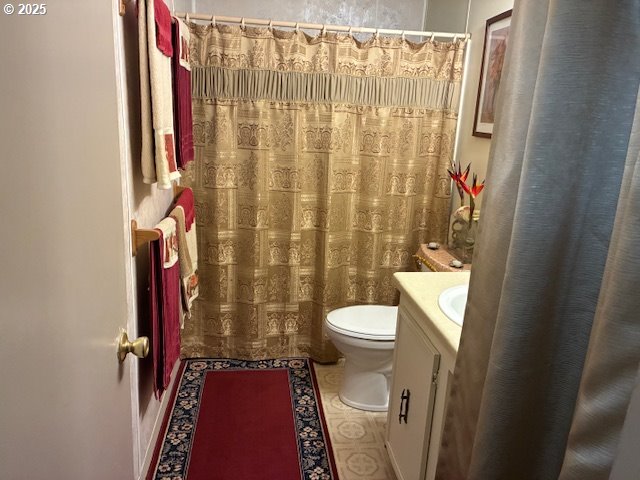 8738 Buckhorn Road Roseburg, OR 97470 - Photo 30 of 45 a bathroom with a toilet and a shower curtain