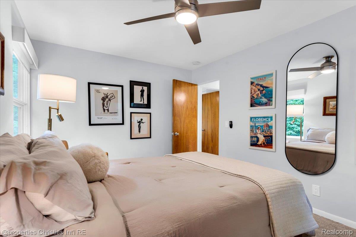 3939 Charing Cross Road Bloomfield Hills, MI 48304 - Photo 25 of 33 Bright interior space featuring a ceiling fan with integrated lighting, light-toned wall paint, and a window with natural light