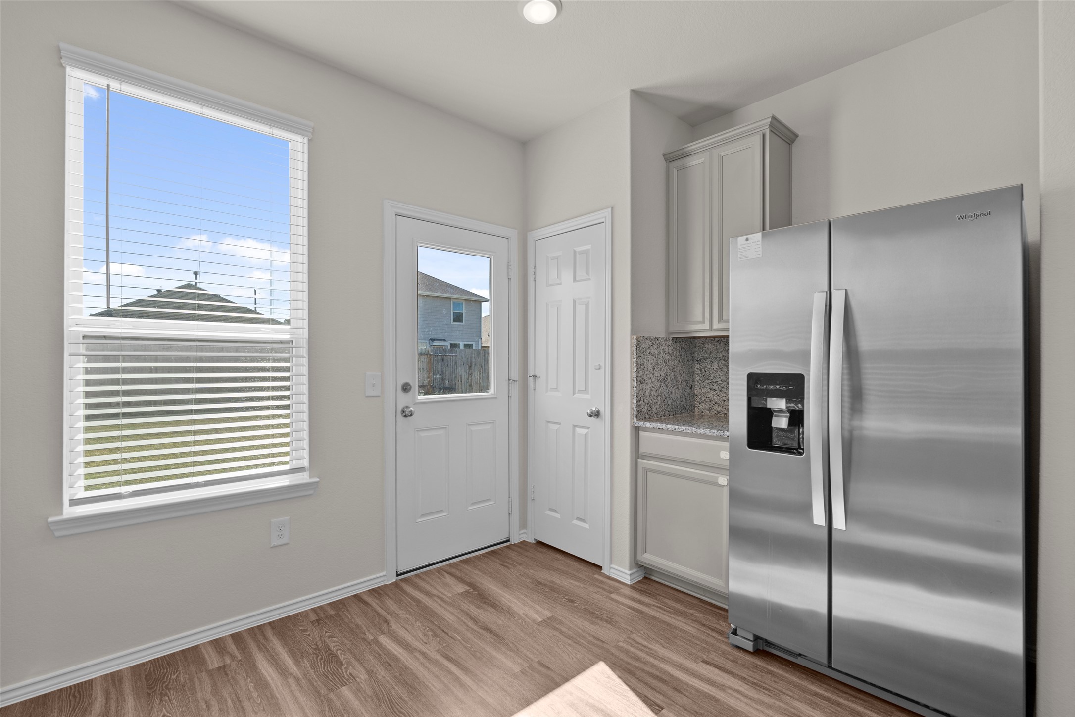 25639 Royal Catchfly Road Katy, TX 77493 - Photo 17 of 48 a view of a kitchen with wooden floor and electronic appliances