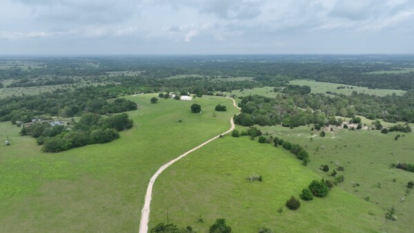 50 Acres Navasota, TX 77868 - Photo 20 of 21 an aerial view of residential houses with outdoor space and trees