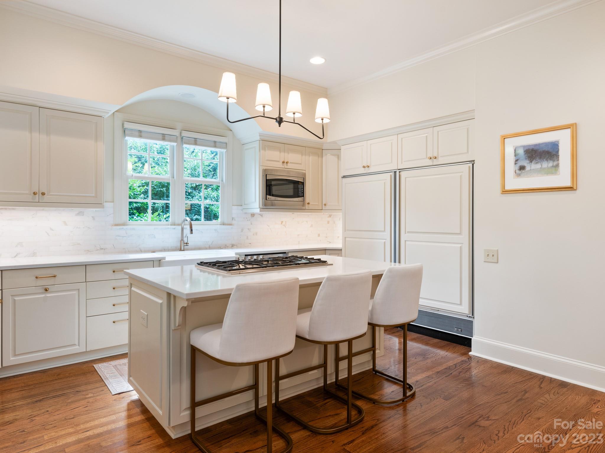 2521 Summerlake Road Charlotte, NC 28226 - Photo 17 of 48 a kitchen with a table chairs refrigerator and window