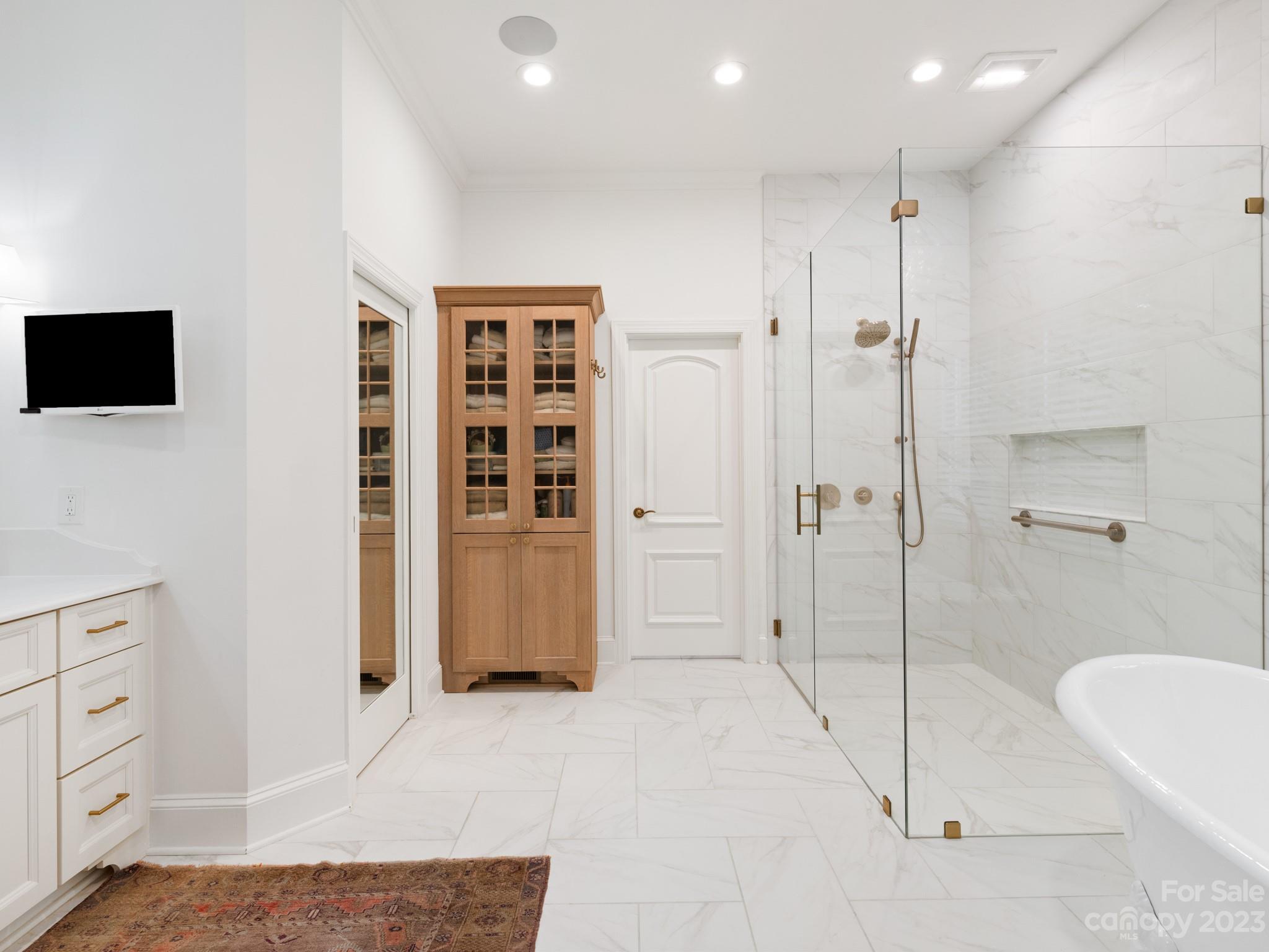 2521 Summerlake Road Charlotte, NC 28226 - Photo 30 of 48 a bathroom with a bathtub and a shower