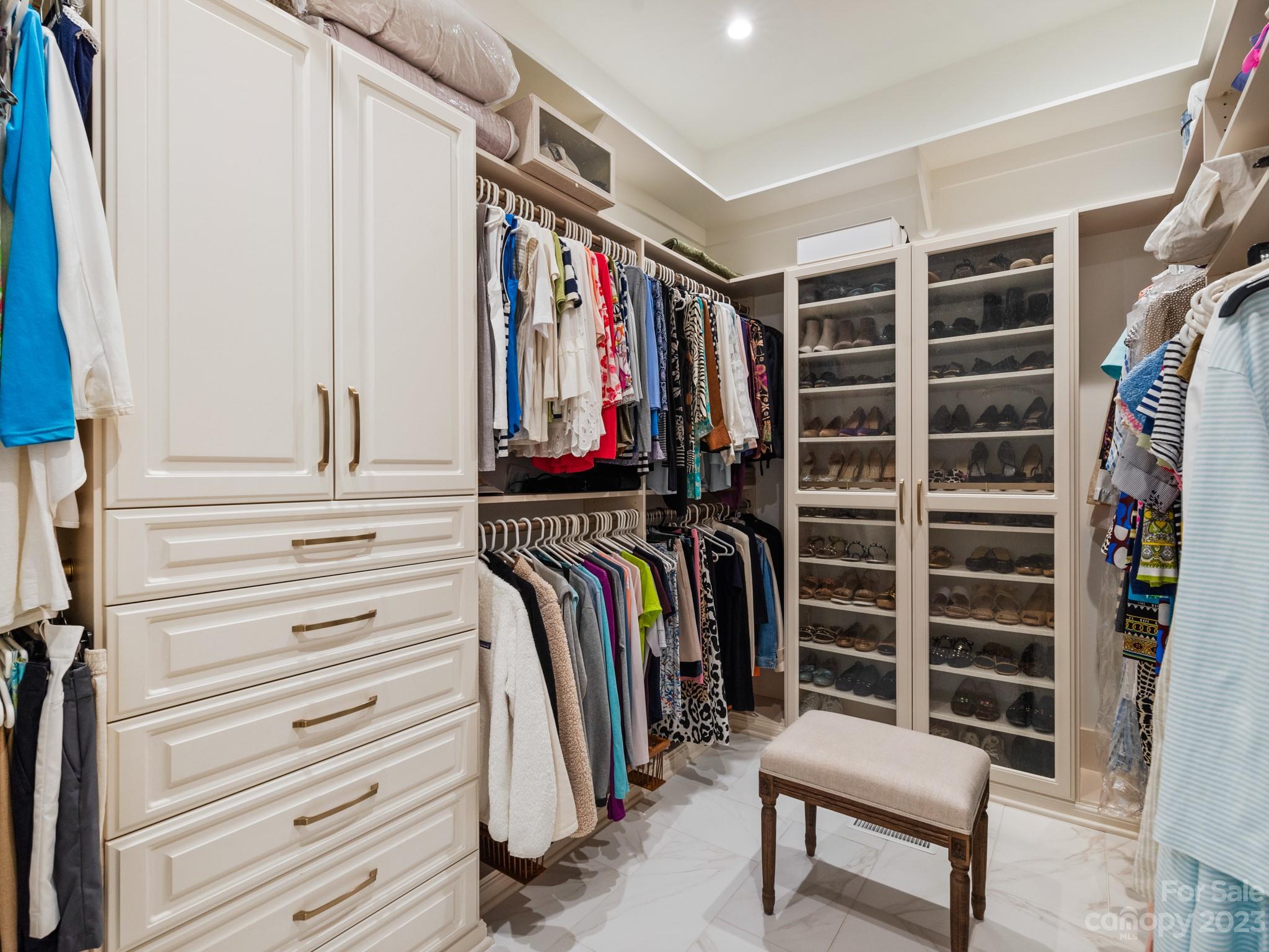2521 Summerlake Road Charlotte, NC 28226 - Photo 31 of 48 a view of walk in closet with clothes and shoes