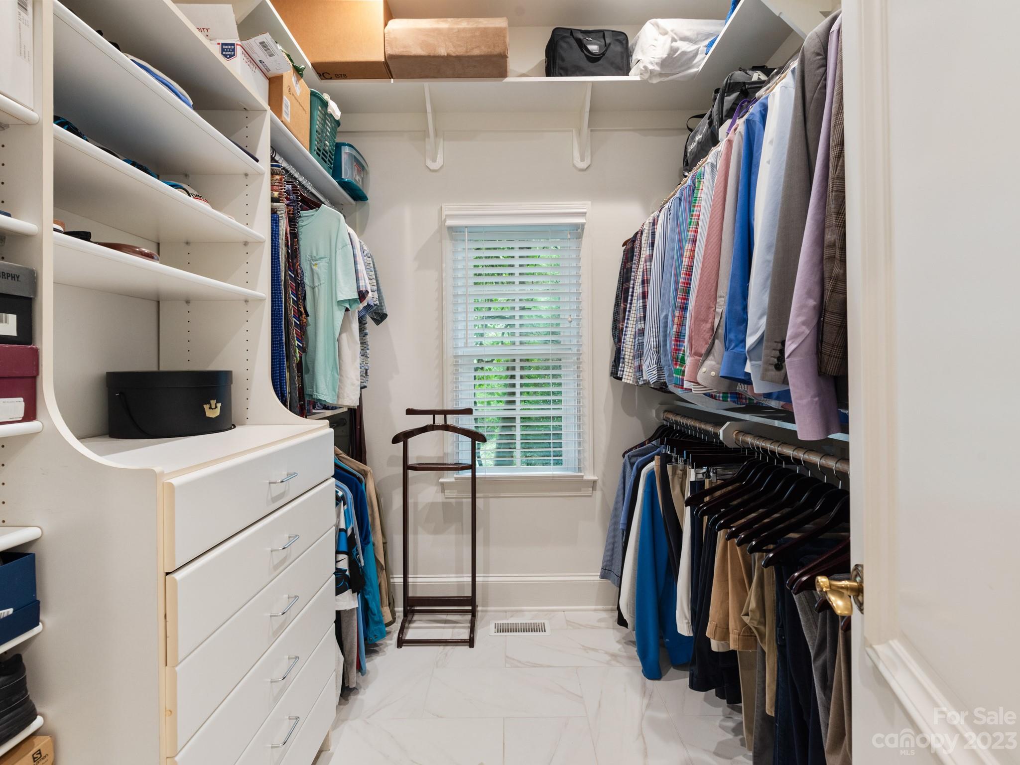 2521 Summerlake Road Charlotte, NC 28226 - Photo 32 of 48 a view of walk in closet with clothes and shoes