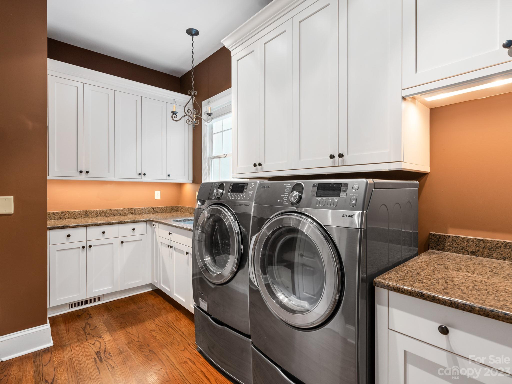 2521 Summerlake Road Charlotte, NC 28226 - Photo 33 of 48 a utility room with granite countertop a sink a washer and dryer