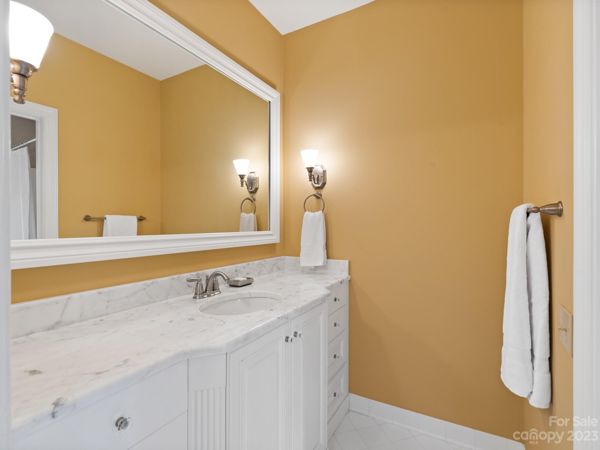 2521 Summerlake Road Charlotte, NC 28226 - Photo 36 of 48 a bathroom with a sink and a mirror