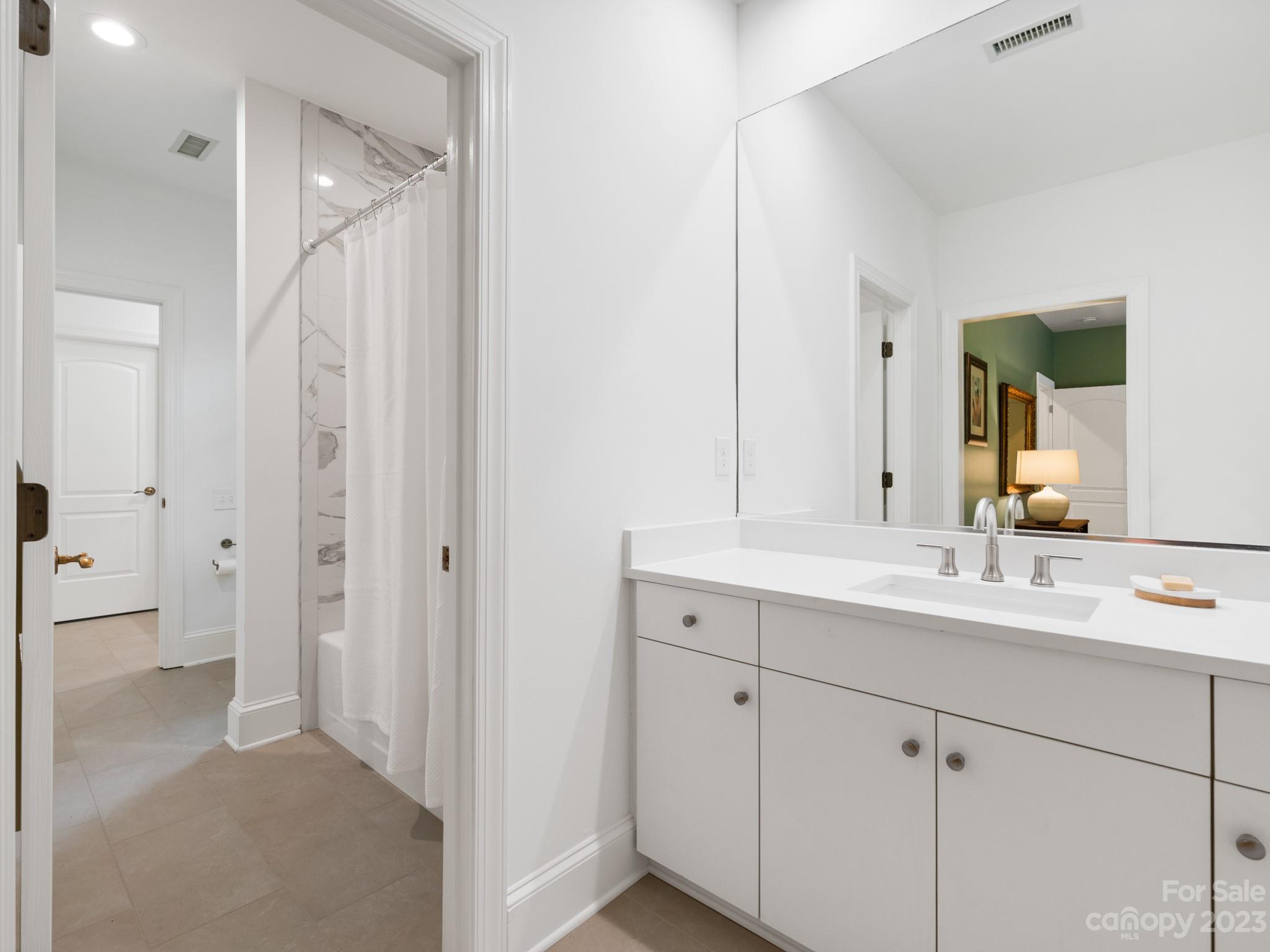 2521 Summerlake Road Charlotte, NC 28226 - Photo 38 of 48 a en suite bathroom with a sink and a mirror