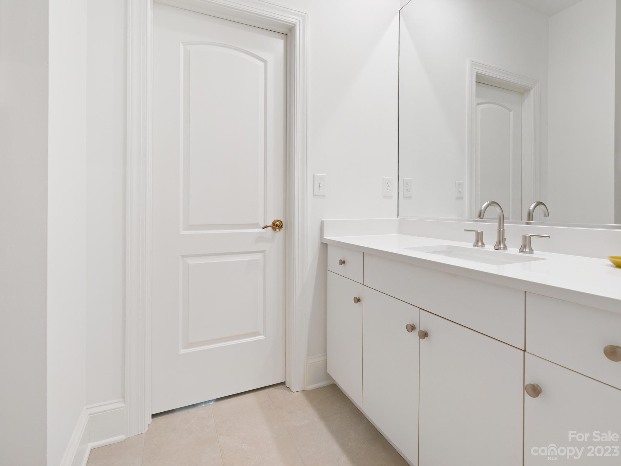 2521 Summerlake Road Charlotte, NC 28226 - Photo 39 of 48 a bathroom with a sink and a mirror