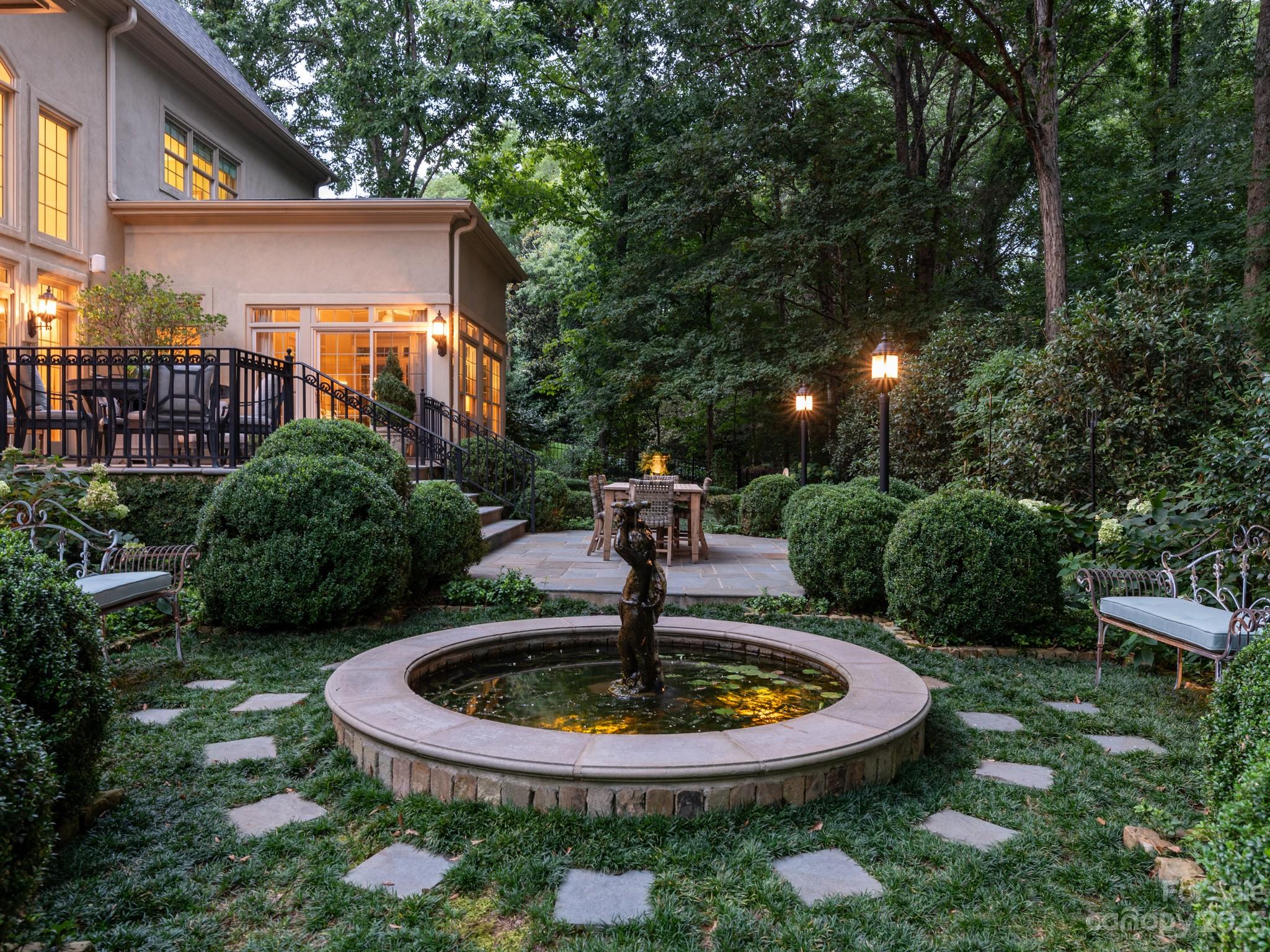 2521 Summerlake Road Charlotte, NC 28226 - Photo 4 of 48 a view of a fountain in the backyard of a house