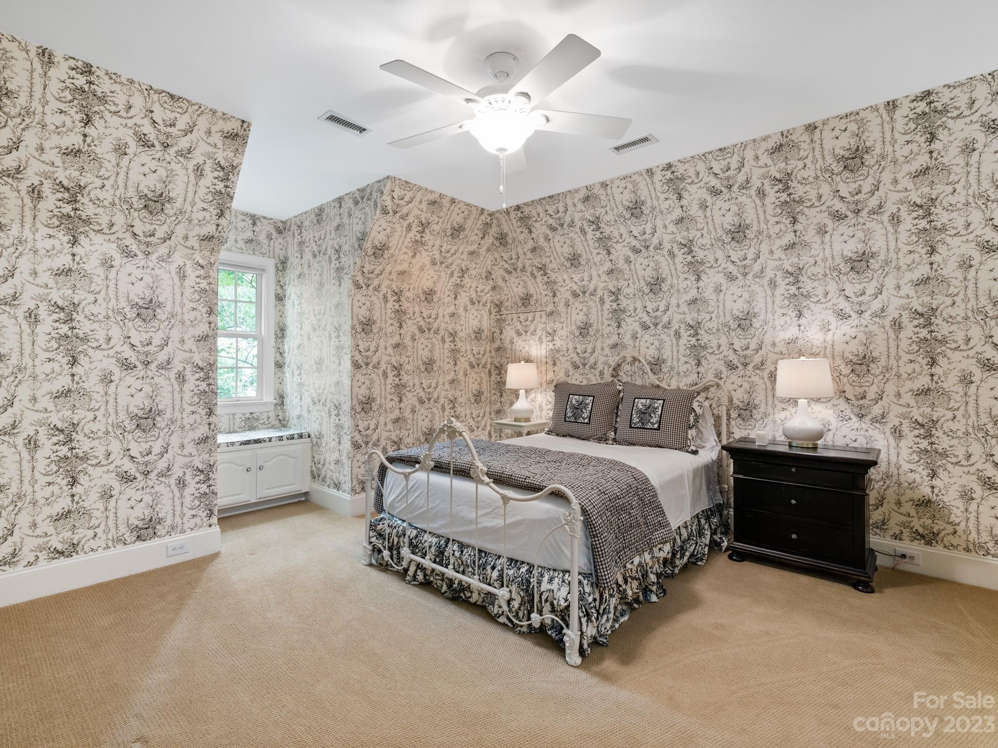 2521 Summerlake Road Charlotte, NC 28226 - Photo 44 of 48 a spacious bedroom with a bed and a ceiling fan