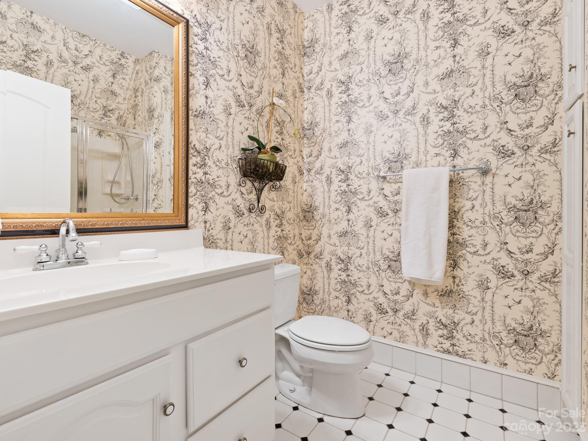 2521 Summerlake Road Charlotte, NC 28226 - Photo 45 of 48 a bathroom with a sink a toilet and shower