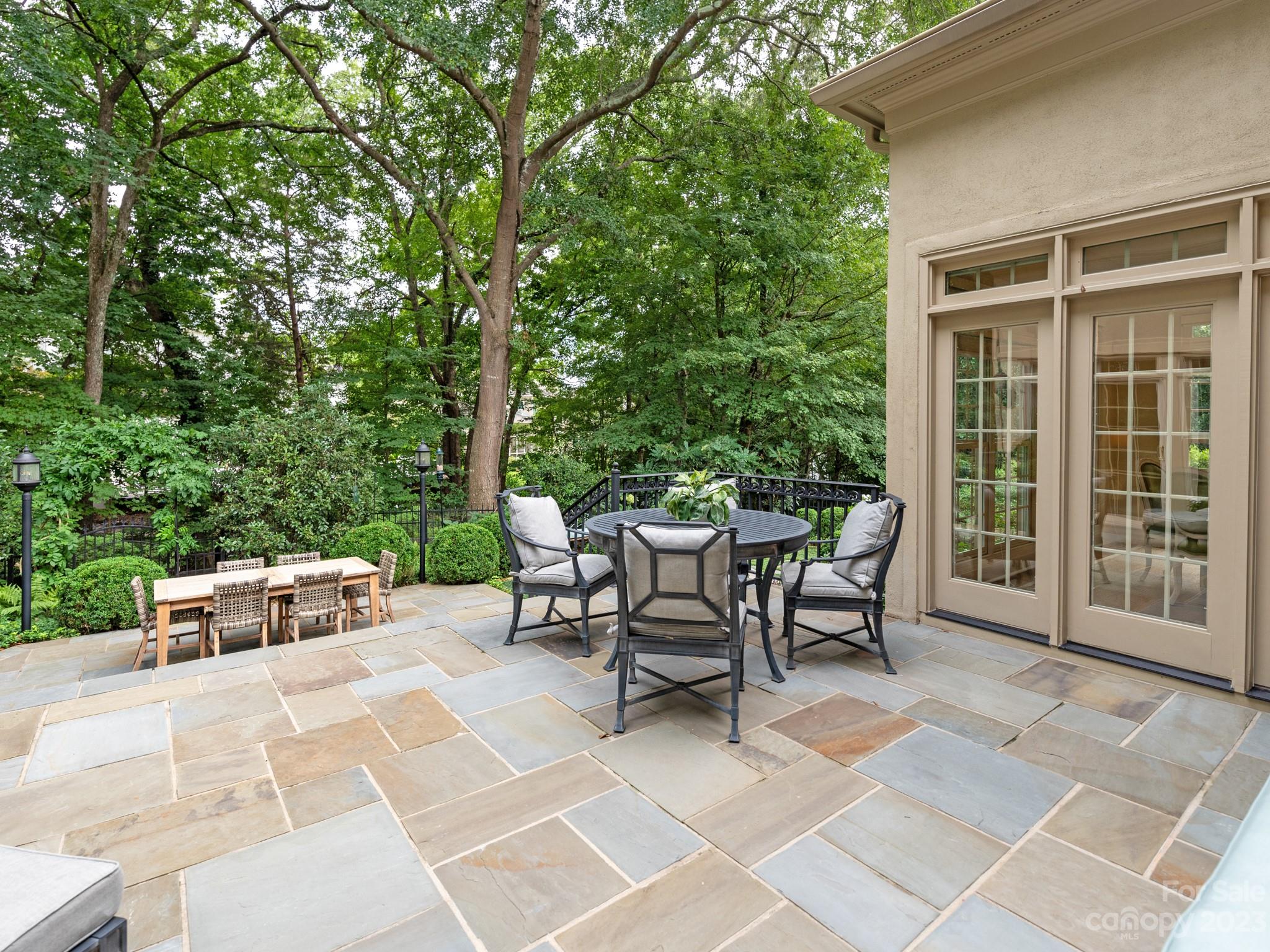 2521 Summerlake Road Charlotte, NC 28226 - Photo 46 of 48 a view of a patio with a dining table and chairs with wooden fence