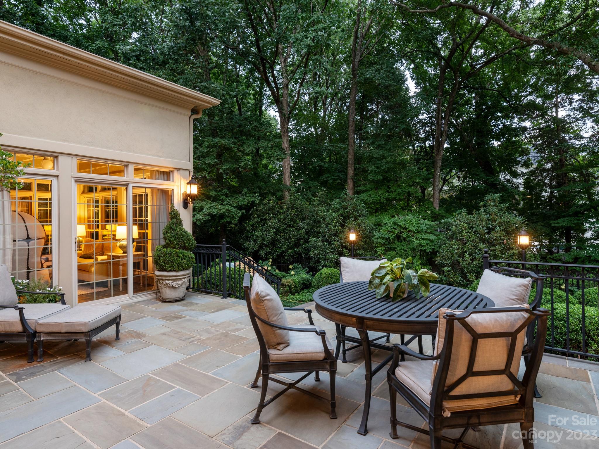 2521 Summerlake Road Charlotte, NC 28226 - Photo 5 of 48 a view of a patio with table and chairs and potted plants