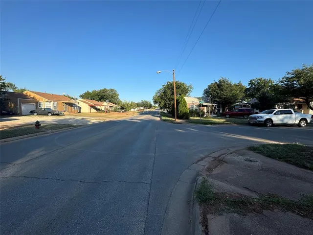 a view of street with parked cars