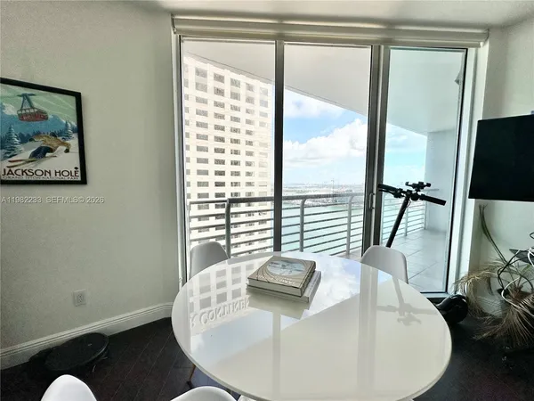 a view of a dining room with furniture window and outside view