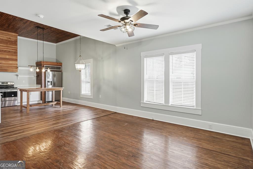 611 West 3rd Street Ocilla, GA 31774 - Photo 12 of 53 a view of an empty room with wooden floor and a window