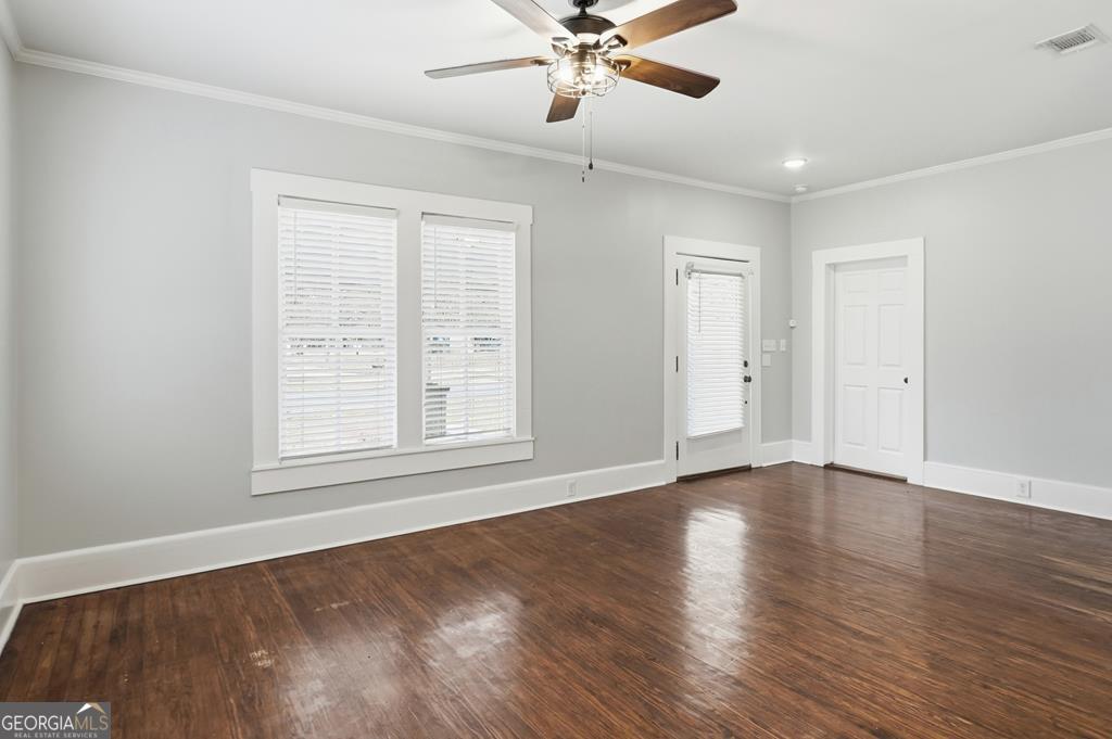 611 West 3rd Street Ocilla, GA 31774 - Photo 15 of 53 a view of an empty room with wooden floor and a window