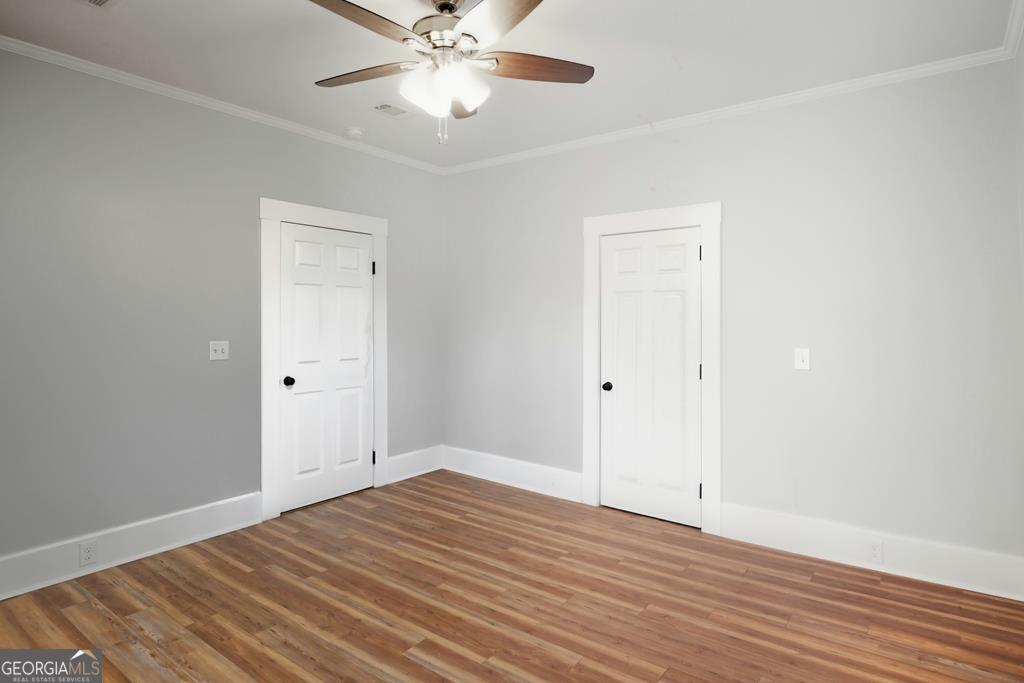 611 West 3rd Street Ocilla, GA 31774 - Photo 17 of 53 wooden floor in an empty room