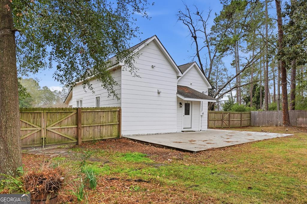 611 West 3rd Street Ocilla, GA 31774 - Photo 33 of 53 a view of a house with backyard and tree