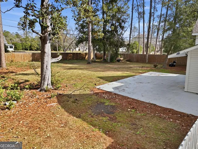 an aerial view of a house with swimming pool