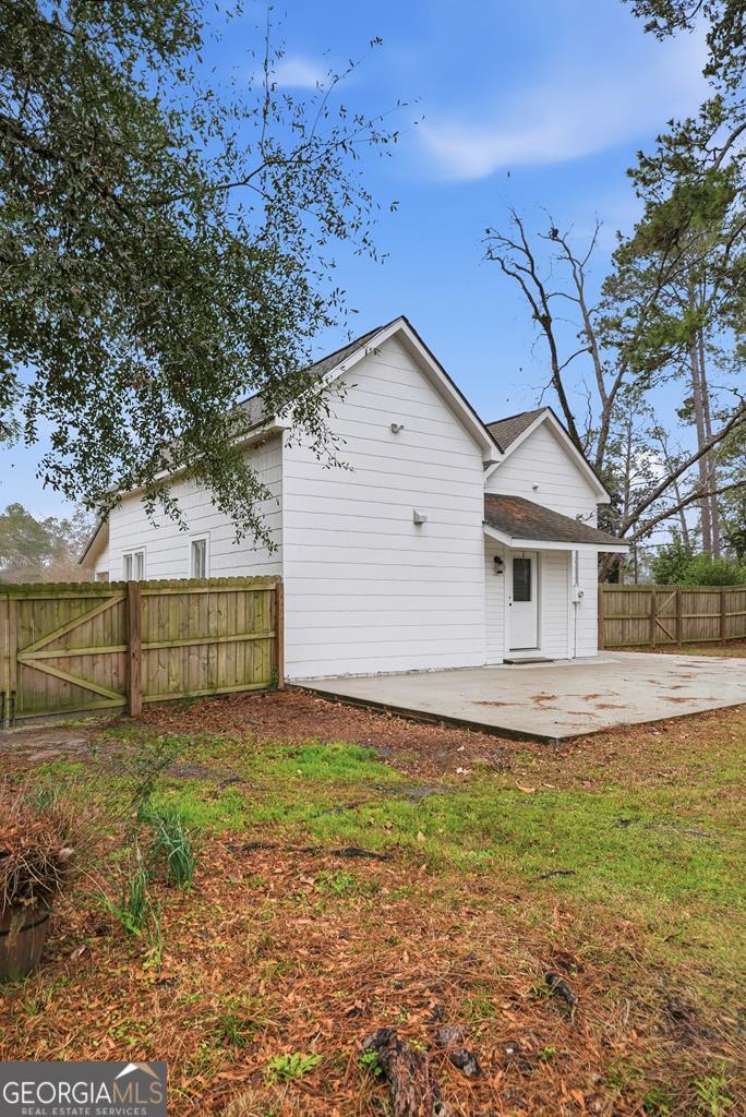 611 West 3rd Street Ocilla, GA 31774 - Photo 35 of 53 a view of a house with a yard