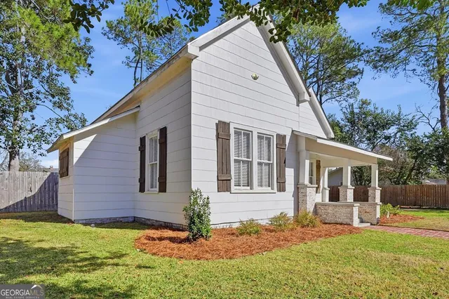 a aerial view of a house with swimming pool