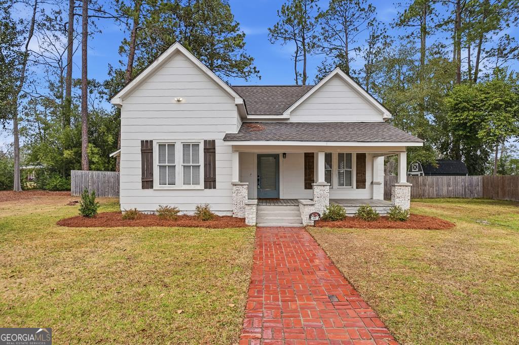 611 West 3rd Street Ocilla, GA 31774 - Photo 41 of 53 a front view of a house with garden